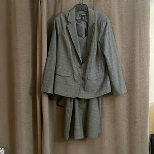 Grey/black suit. Size 22. Below Knee.  Wore once